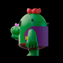 a green cactus with a red bow on top