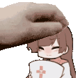 a hand is petting a cartoon girl 's head while she holds a pillow .