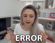 a woman in a white shirt has the word error written on her chest