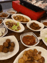 a table topped with plates of food and a red stove