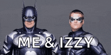 two men in superhero costumes are standing next to each other with the words me & izzy written on the bottom