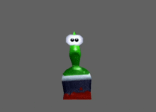 a green cartoon character with a white head and eyes