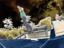 a person is doing a trick on a trampoline at night