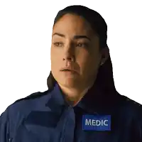 a woman wearing a blue shirt with a patch that says medic on it