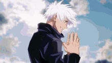 a man with white hair is standing in front of a blue sky with his hands folded .