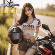 a woman is holding a helmet and wearing a shirt that says sbobet