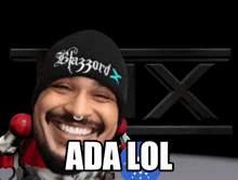 a man wearing a beanie that says blazord x
