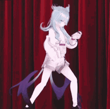 a girl with blue hair is dancing on a stage with a purple tail