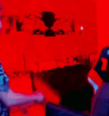 a blurry picture of a man playing a video game with a green background