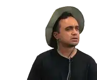 a man wearing a hat and earbuds is making a sad face
