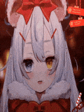a girl with white hair and horns is wearing a santa hat and a bow