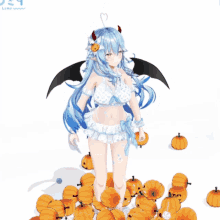 a girl with horns and wings is surrounded by pumpkins