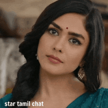 a woman with a red dot on her forehead looks at the camera with the words star tamil chat below her