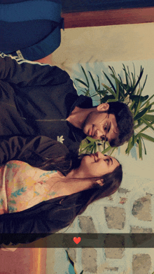 a man and a woman are looking at each other and the man has an adidas jacket on