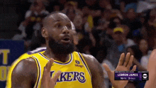 lebron james is wearing a lakers jersey during a game