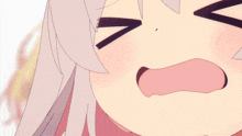 a close up of a girl 's face with a pink tongue out