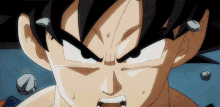 a close up of a cartoon character 's face with rocks coming out of his mouth