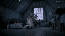 a little girl is sitting on the floor in a room with #cryptv written on the bottom