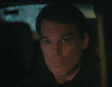 a close up of a man 's face making a funny face