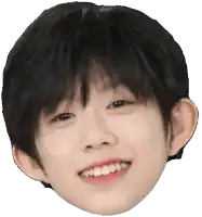 a close up of a child 's face with a smile on it