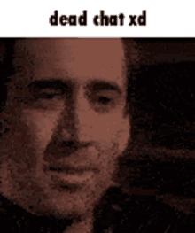 a close up of a man 's face with the words `` dead chat xd '' written on the bottom .