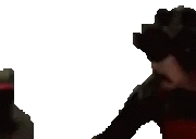 a pixelated image of a man standing next to a bottle of alcohol .