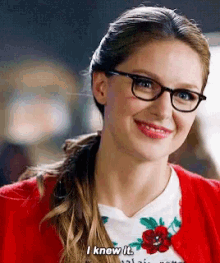 a woman wearing glasses and a red cardigan says " i knew it "