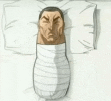 a cartoon of a man wrapped in bandages is laying on a pillow