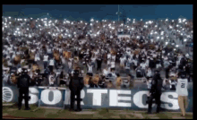 the word sortecs is on a sign in front of a crowd