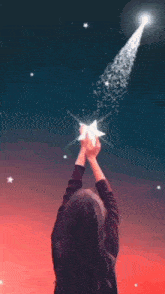 a girl is holding a star in her hands and the name samyeli is on the bottom right