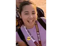 a girl wears a lanyard that says college of technology