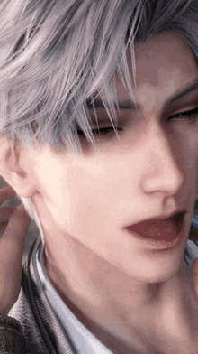 a close up of a man 's face with gray hair and a white shirt .