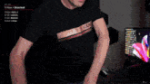 a man wearing a black shirt that says gucci
