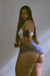 a woman is taking a picture of herself with her phone