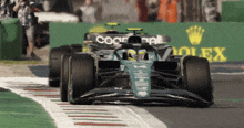 a race car with the word rolex on it