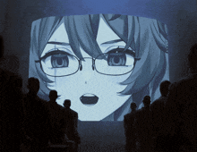 a group of people looking at a screen with a picture of a girl with glasses on it
