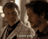 two men are looking at each other and one of them is saying i want you