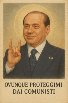 a poster of a man in a suit and tie with the words " ovunque proteggimi dai comunisti " on it