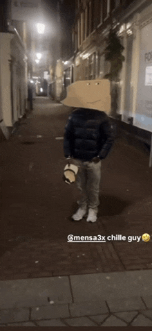 a man with a cardboard box on his head