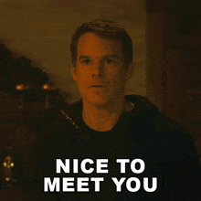 a man says " nice to meet you " in front of him