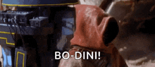 a person wearing a red hooded jacket is standing in front of a machine and says bo-dini !