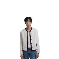 a man in a white jacket and jeans is raising his arms
