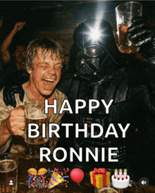 a man in a darth vader costume is holding a glass of beer