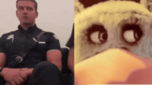 a police officer sits next to a picture of an owl with big eyes