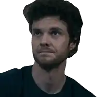 a man with a beard is wearing a black shirt and looking up