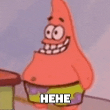 patrick star from spongebob squarepants is smiling while standing next to a drum .