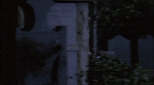 a blurred image of a person standing in front of a sign that says " do n't park here "