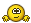 a pixelated smiley face with a smirk on its face and two hands behind it .