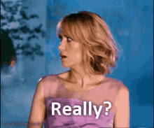 a woman in a purple dress is asking really