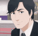 a man in a suit and tie is smiling and looking at the camera
